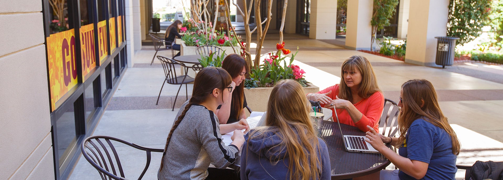 photo of graduate students studying outside