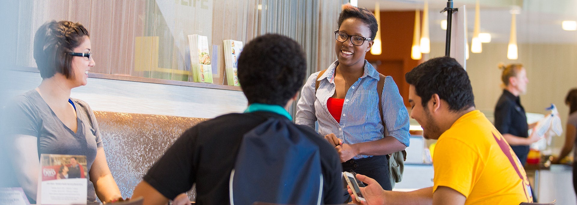 Students in dining hall sharing a meal