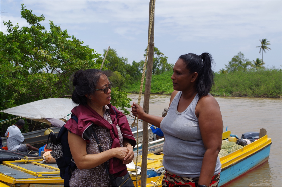  Nalini, one of the few fisher - women in Guyana, chats about her work in the sector with ASUâs Dr. Nalini Chhetri and Gabrielle Lout (not pictured).