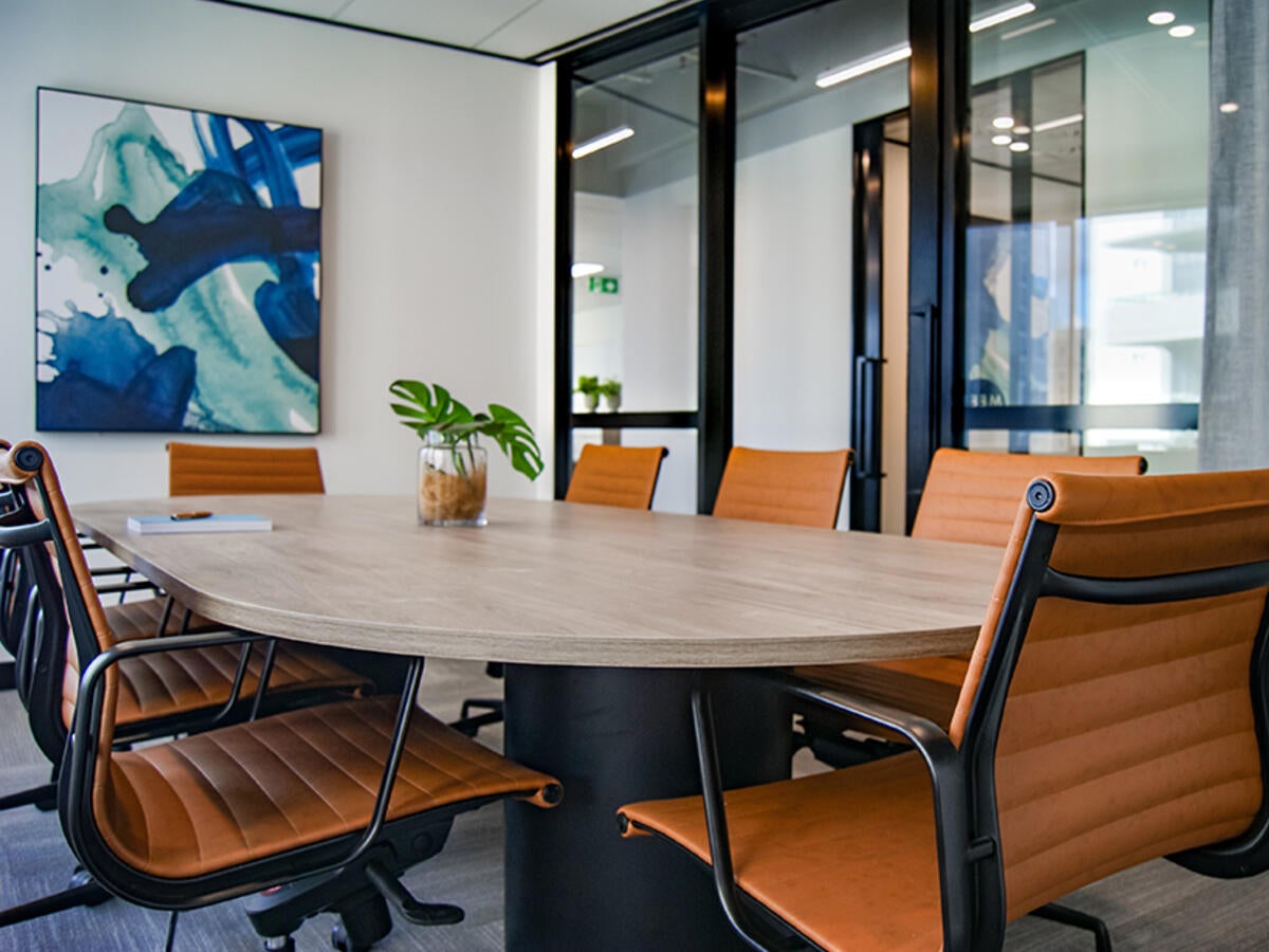 photo of boardroom table with chairs
