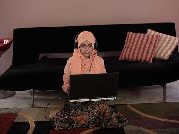 photo of student at home with computer