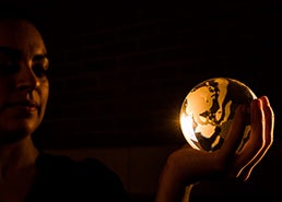 photo of student holding glass globe