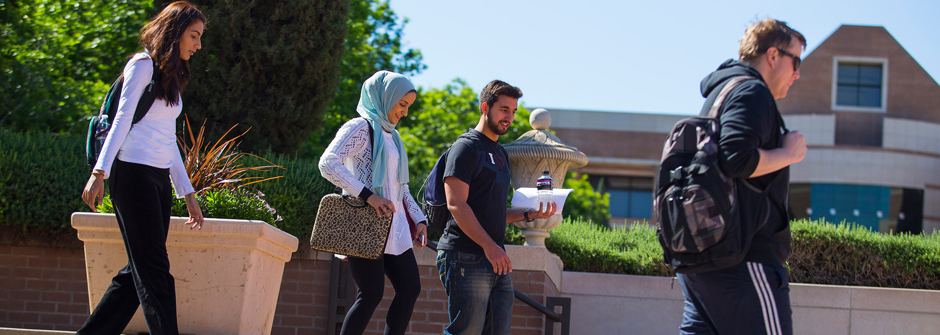 photo of students walking by ASU fountains