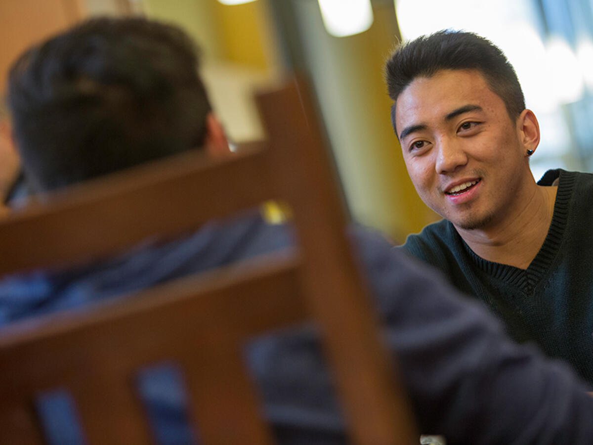 photo of student talking with another student